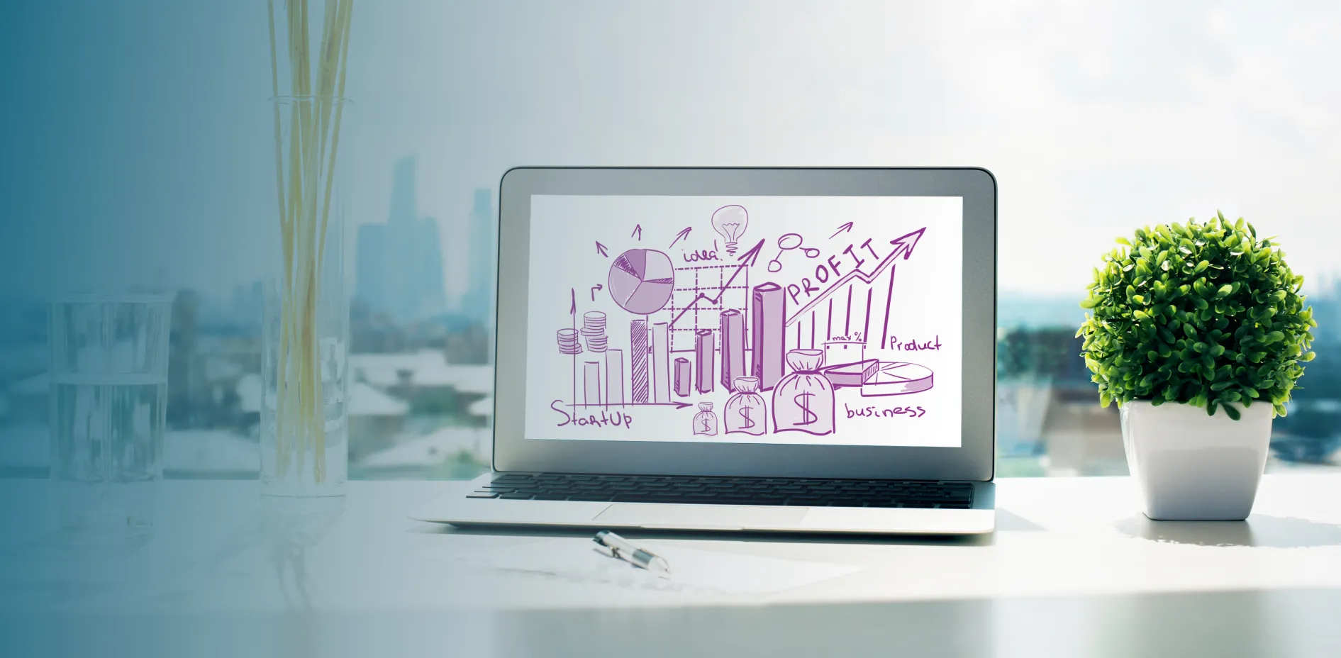 Laptop showing a business growth sketch on an office desk