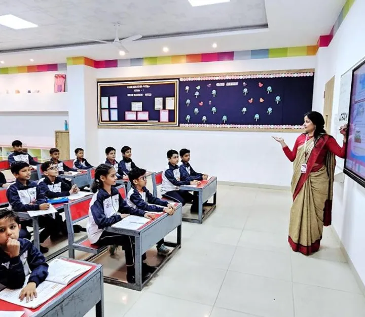 Teacher presenting at a smart board to a classroom of students