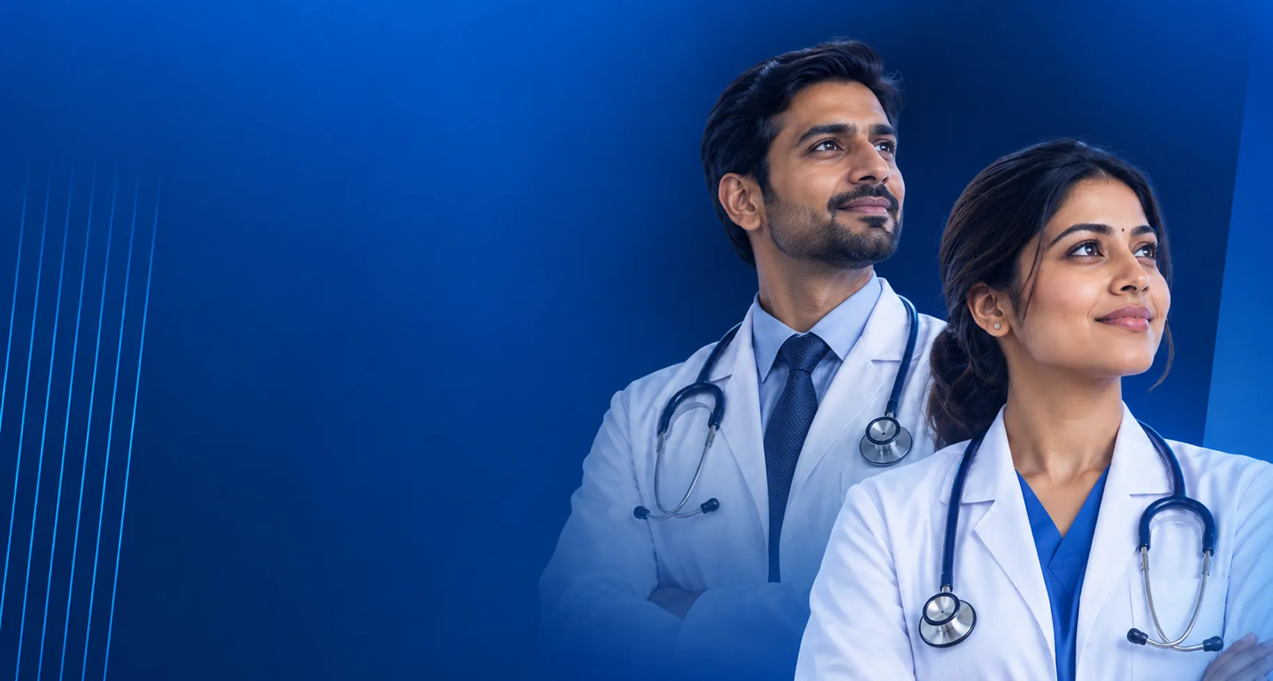 Two Indian doctors in white coats with stethoscopes looking ahead with confidence